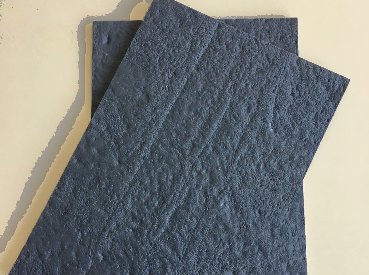 Two anthracite cable cover plates stacked on top of each other