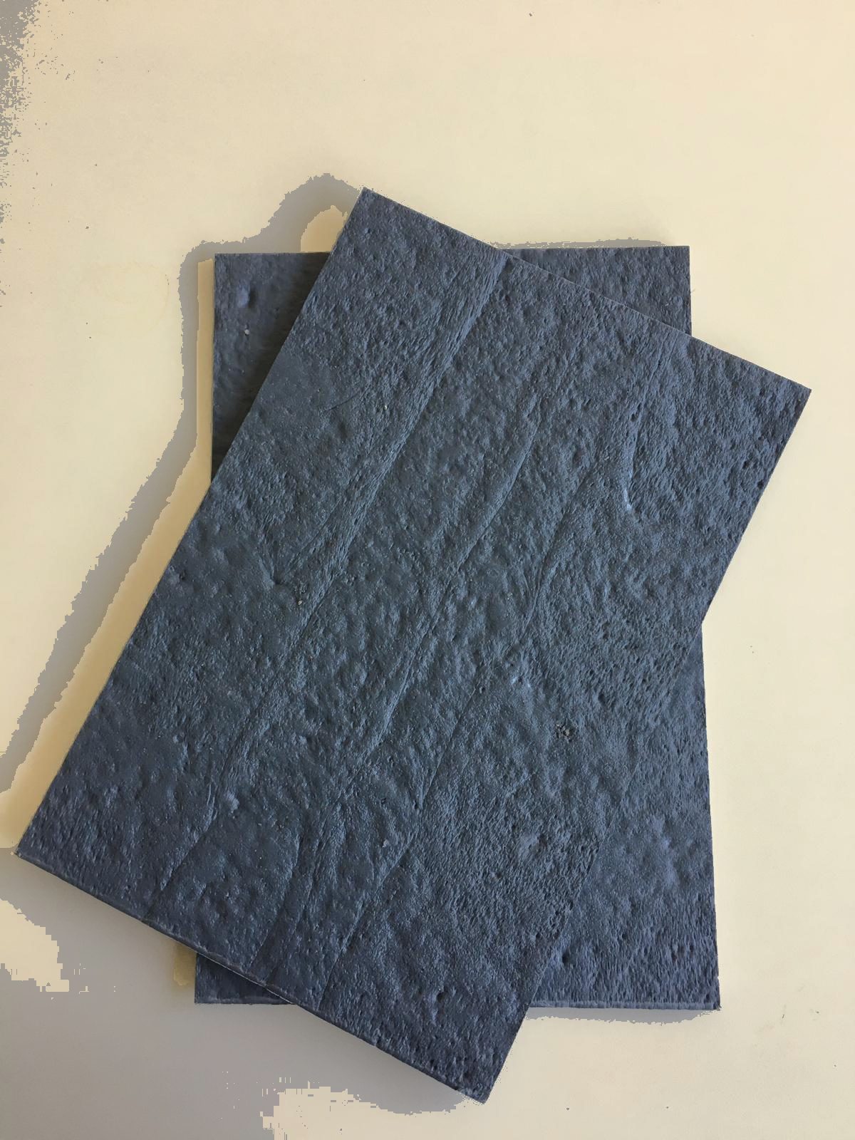Two cover plates stacked, showing the edge thickness
